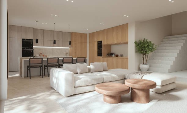 Modern kitchen with white cabinets, a large island, pendant lights, and wooden accents.