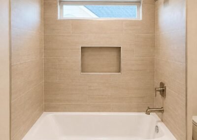 Tub and Shower Remodel with Large-Format Tile and Built-In Niche